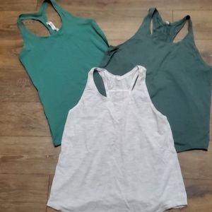 3 Lululemon tank tops size 12 2 loose fit one fitted